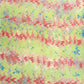 a sheet of wrapping paper with a marbled design in lime green, red and blue