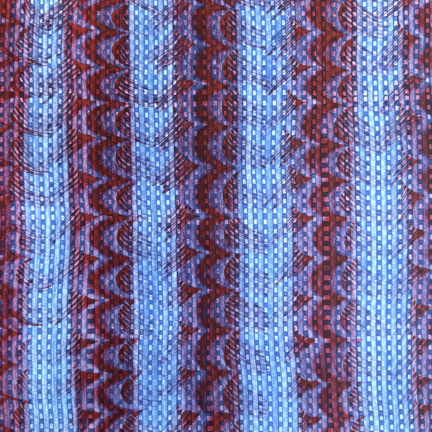 a sheet of wrapping paper with a paste paper style design in blue and dark red