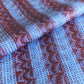 a sheet of wrapping paper with a paste paper style design in blue and dark red