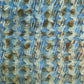 a sheet of wrapping paper with a paste paper style design in blue and brown