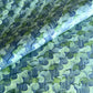 a sheet of wrapping paper with an abstract paste paper design in blue and green