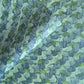a sheet of wrapping paper with an abstract paste paper design in blue and green