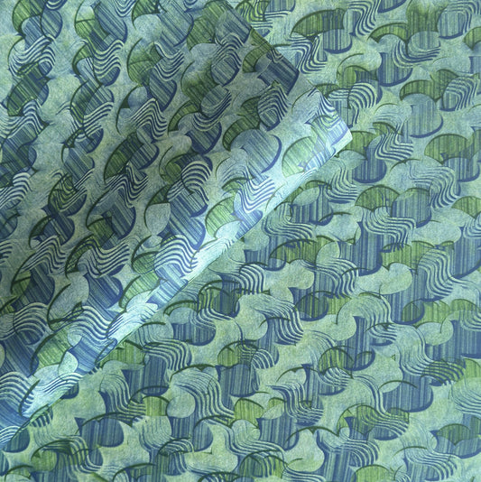 a sheet of wrapping paper with an abstract paste paper design in blue and green