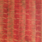 a sheet of wrapping paper with a paste paper style design in red and yellow