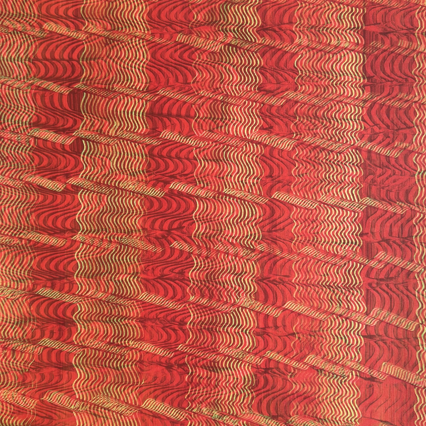 a sheet of wrapping paper with a paste paper style design in red and yellow