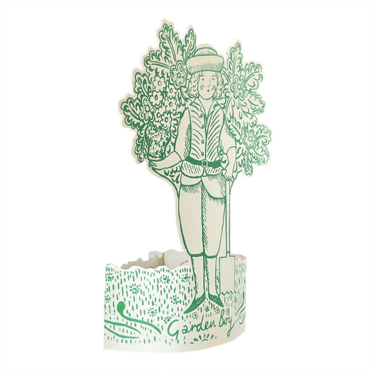 A cut-out and stand up greetings card of a garden boy next to a small tree, by Elizabeth Harbour