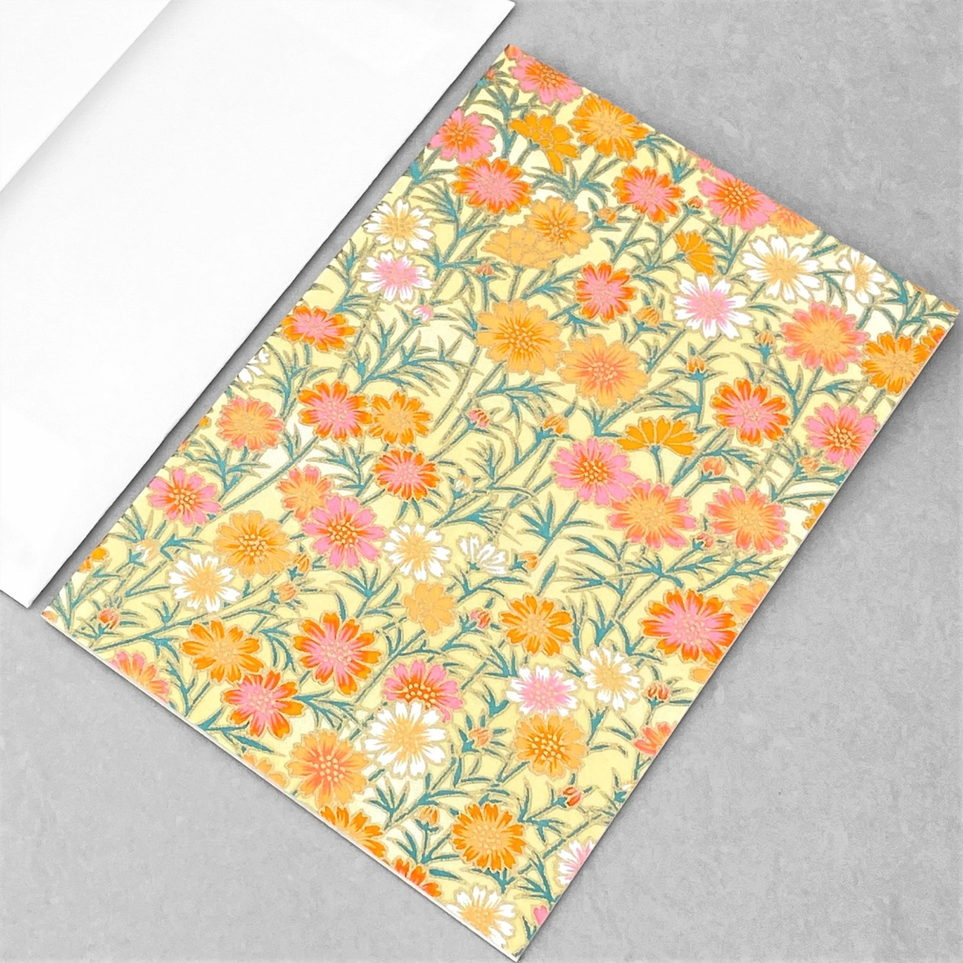 japanese silk-screen printed greetings card with repeat daisy pattern in yellow, pink and orange by Esmie