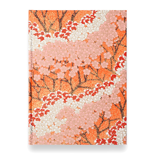 hardback A5 plain notebook with cover made of japanese silkscreen chiyogami paper. Pink and white cherry blossom design on peach background by Esmie