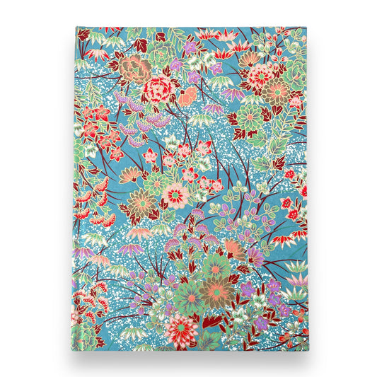 hardback A5 plain notebook with cover made of japanese silkscreen chiyogami paper. Multicolour floral bouquet pattern on teal background by Esmie