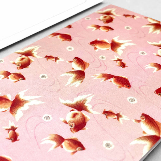 greetings card with repeat pattern of orange goldfish and pink backdrop by Ezen Design