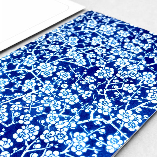 greetings card showing a small scale blue and white cherry blossom repeat pattern by Ezen design