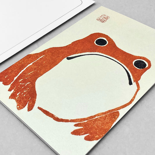 greetings card of a japanese frog coloured orange by Ezen Design