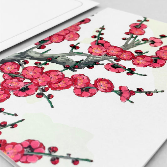 greetings card with a branch of deep pink plum blossom by Ezen Design