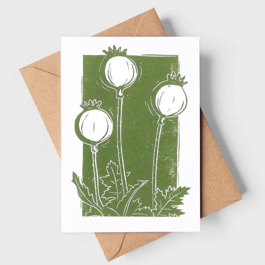 Card with white seed head design on a green background, featuring a brown envelope.