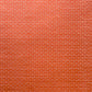 a sheet of gift wrap with a small brick design in rich red and pink