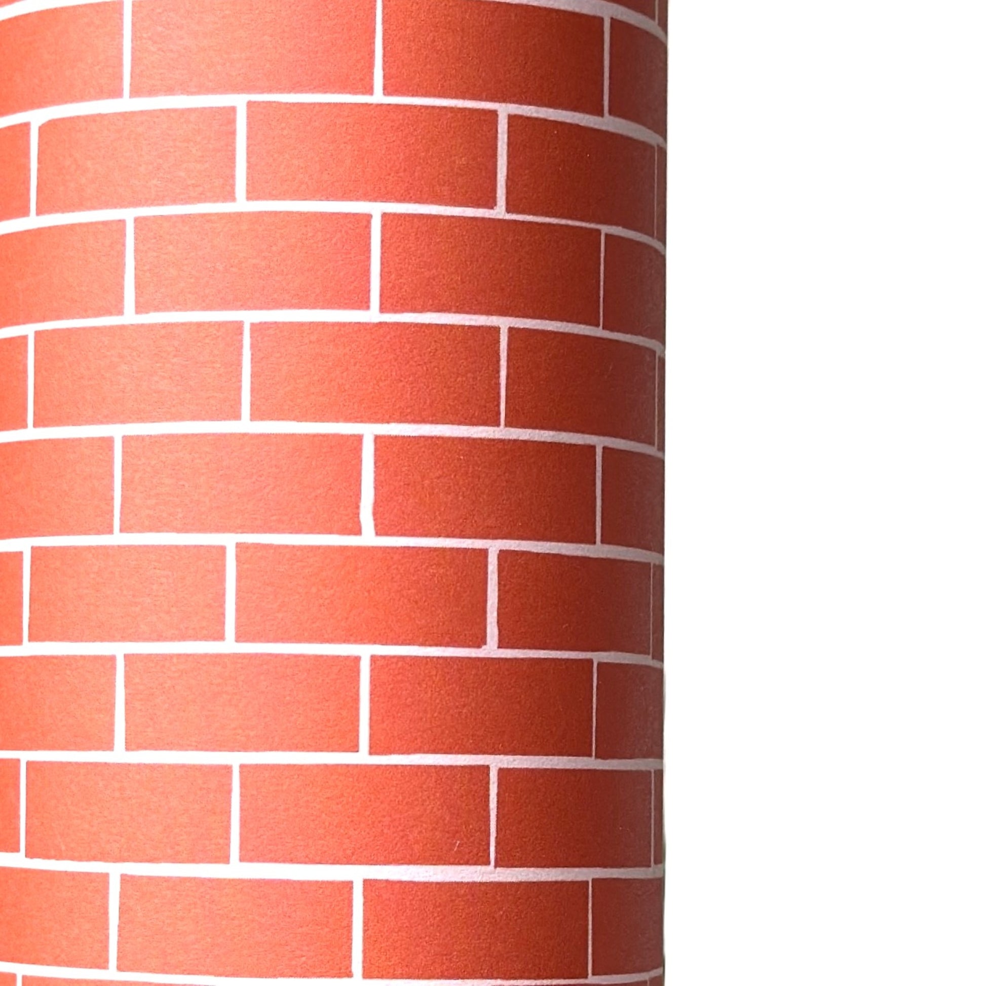 a sheet of gift wrap with a small brick design in rich red and pink