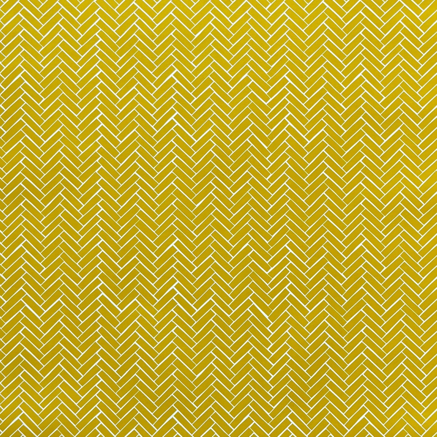 a sheet of wrapping paper with a parquet floor design in mustard and white