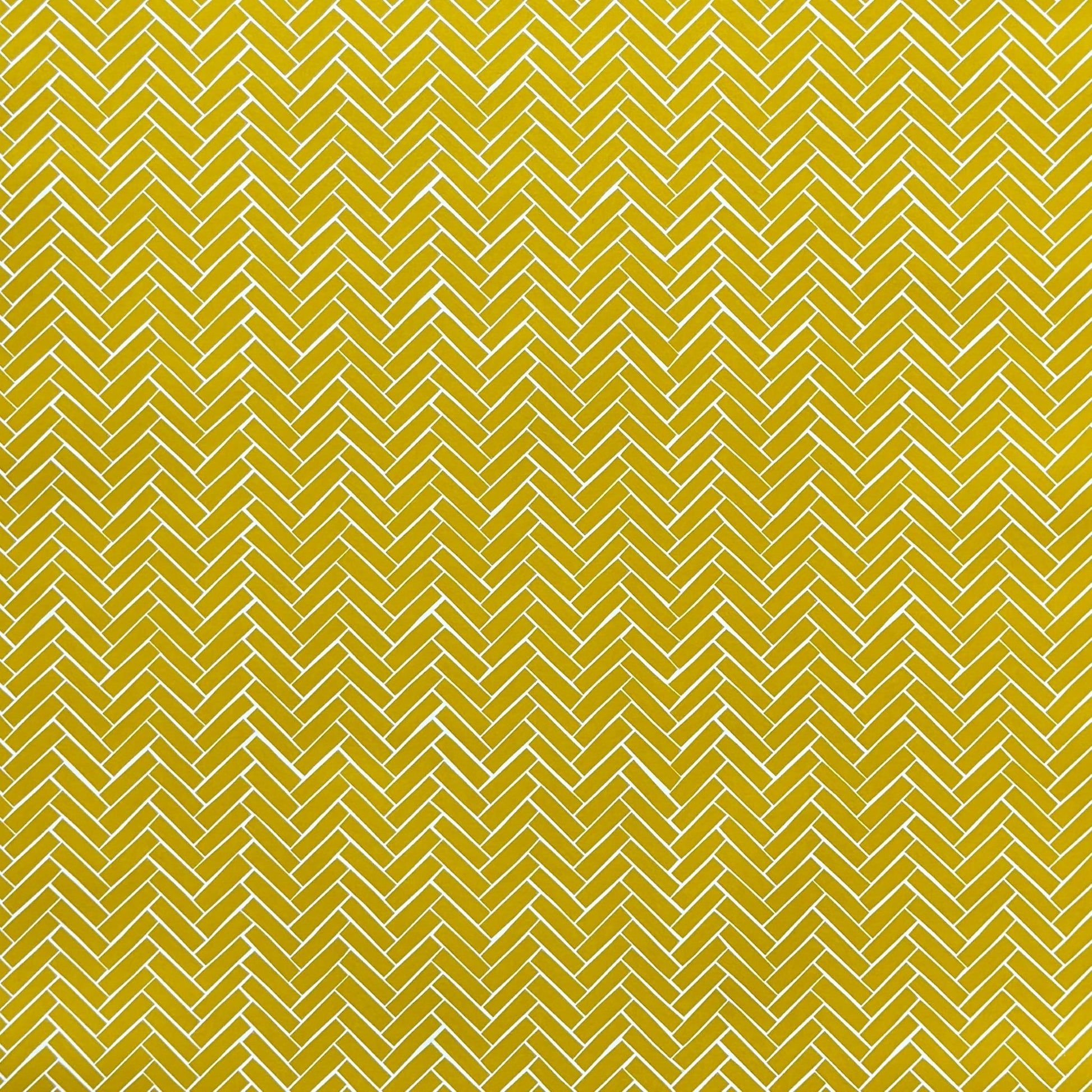 a sheet of wrapping paper with a parquet floor design in mustard and white
