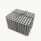 a sheet of wrapping paper with a quarry tile chequerboard design in very dark green and pale pink