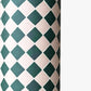 a sheet of wrapping paper with a quarry tile chequerboard design in very dark green and pale pink