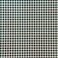 a sheet of wrapping paper with a quarry tile chequerboard design in very dark green and pale pink