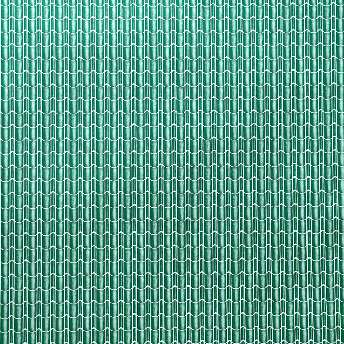 a sheet of wrapping paper with a pattern of green roof tiles