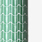 a sheet of wrapping paper with a pattern of green roof tiles