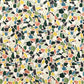Colorful terrazzo pattern on a pale pink background. A sheet of wrapping paper