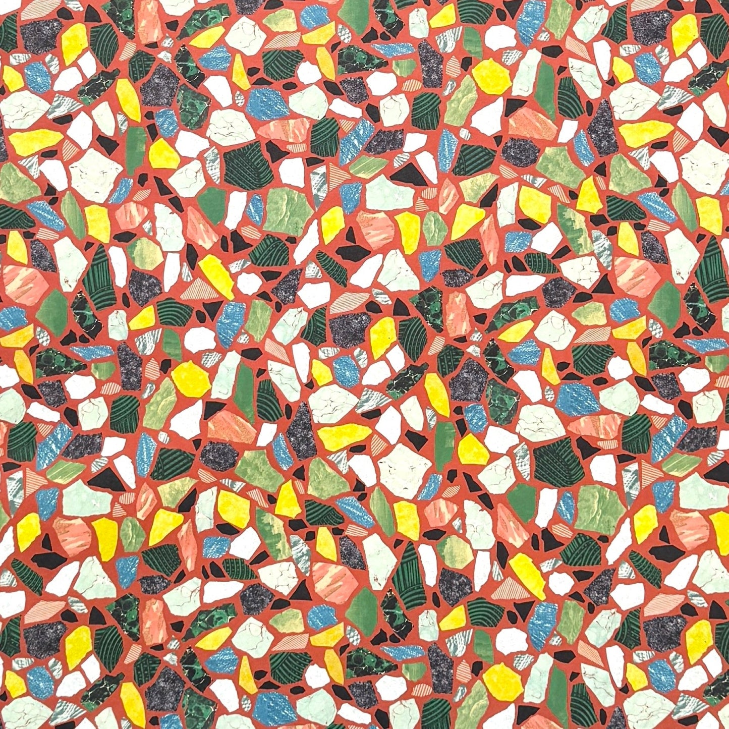Colorful terrazzo pattern on a red background. A sheet of wrapping paper.