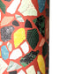Colorful terrazzo pattern on a red background. A sheet of wrapping paper.