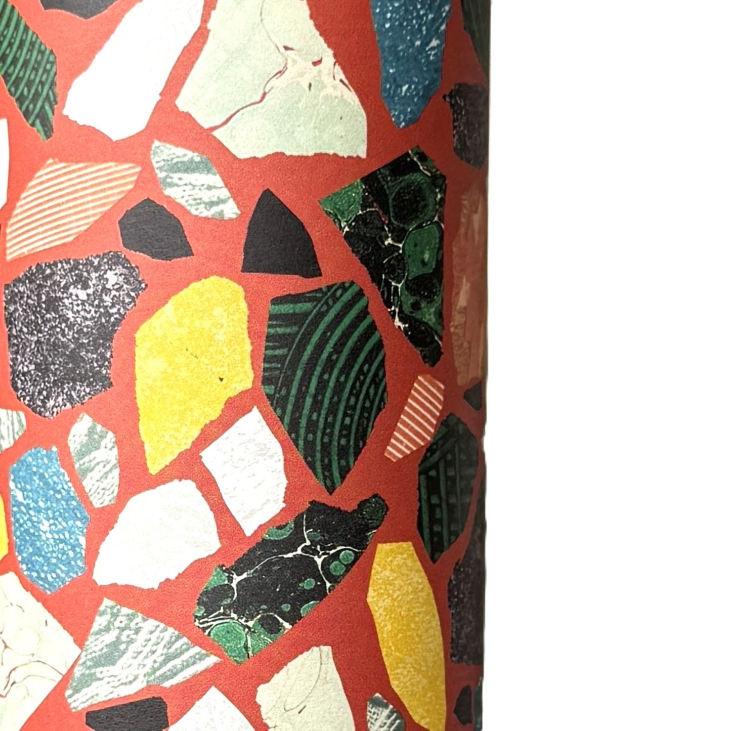 Colorful terrazzo pattern on a red background. A sheet of wrapping paper.