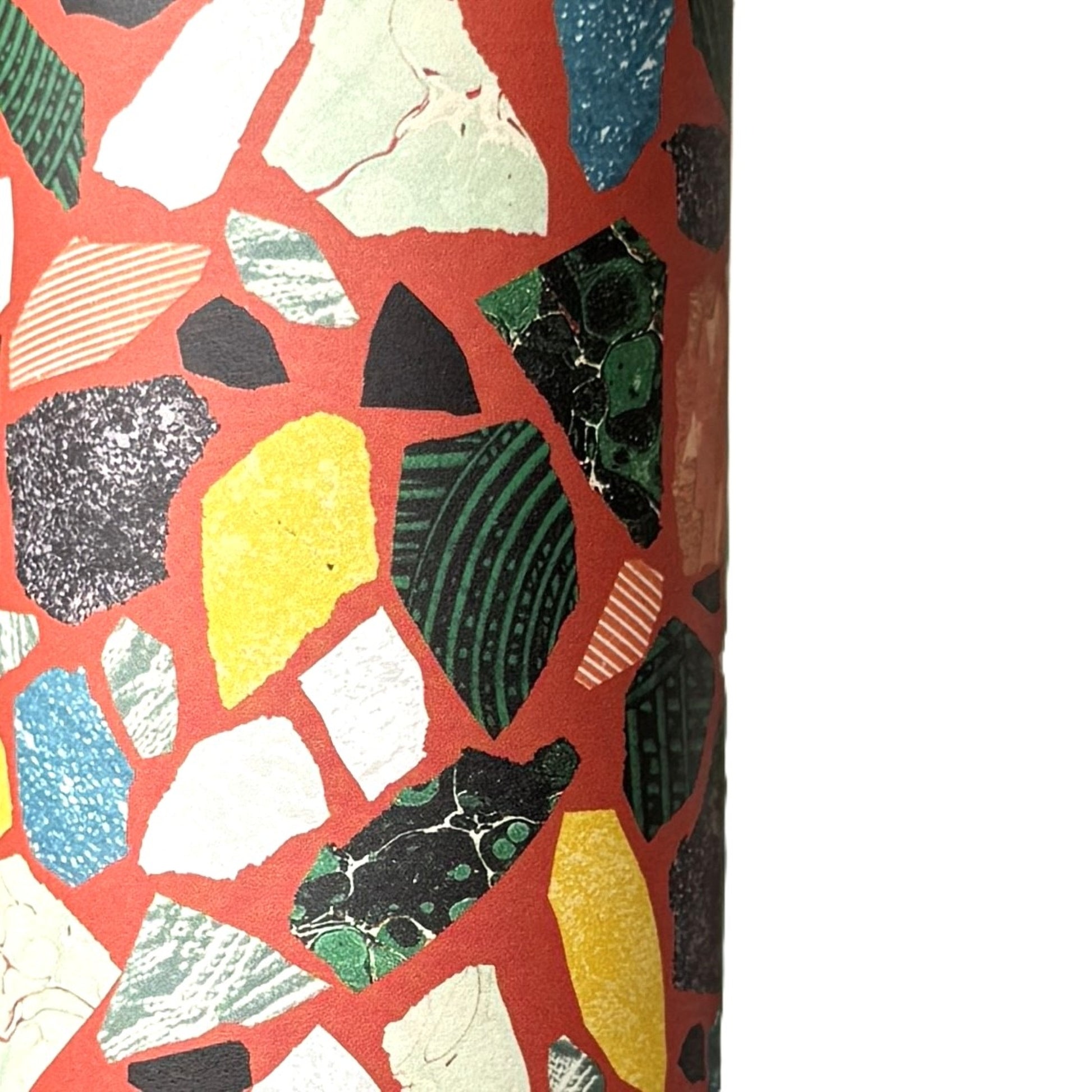 Colorful terrazzo pattern on a red background. A sheet of wrapping paper.