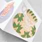 concertina card with four cups and saucers on four separate folds, by Hadley Paper Goods