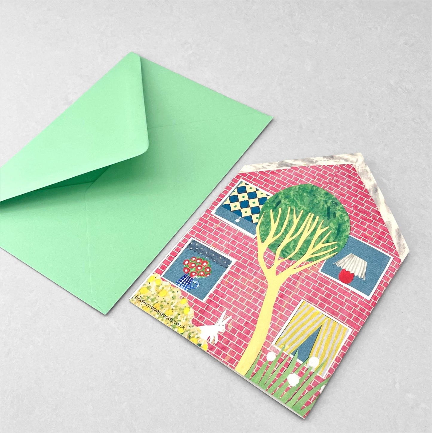 shaped greetings card of a house with four windows and a yellow door by Hadley Paper Goods
