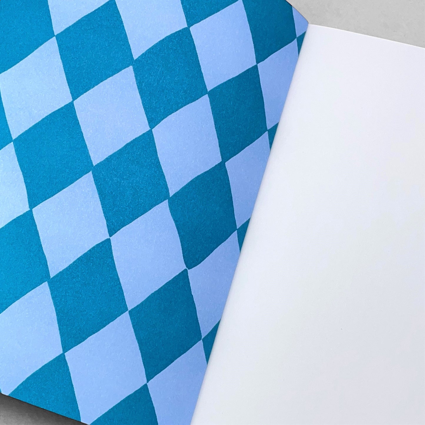 A5 notebook with diamond pattern in dark blue and light blue by Heather Evelyn