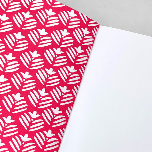 A5 notebook with magenta pink cover and repeat pattern of white flowers by Heather Evelyn