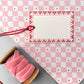 wrapping paper with pale pink and white diagonal checkerboard pattern by Heather Evelyn