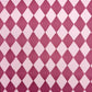 wrapping paper with large diamond design in mauve and pink.