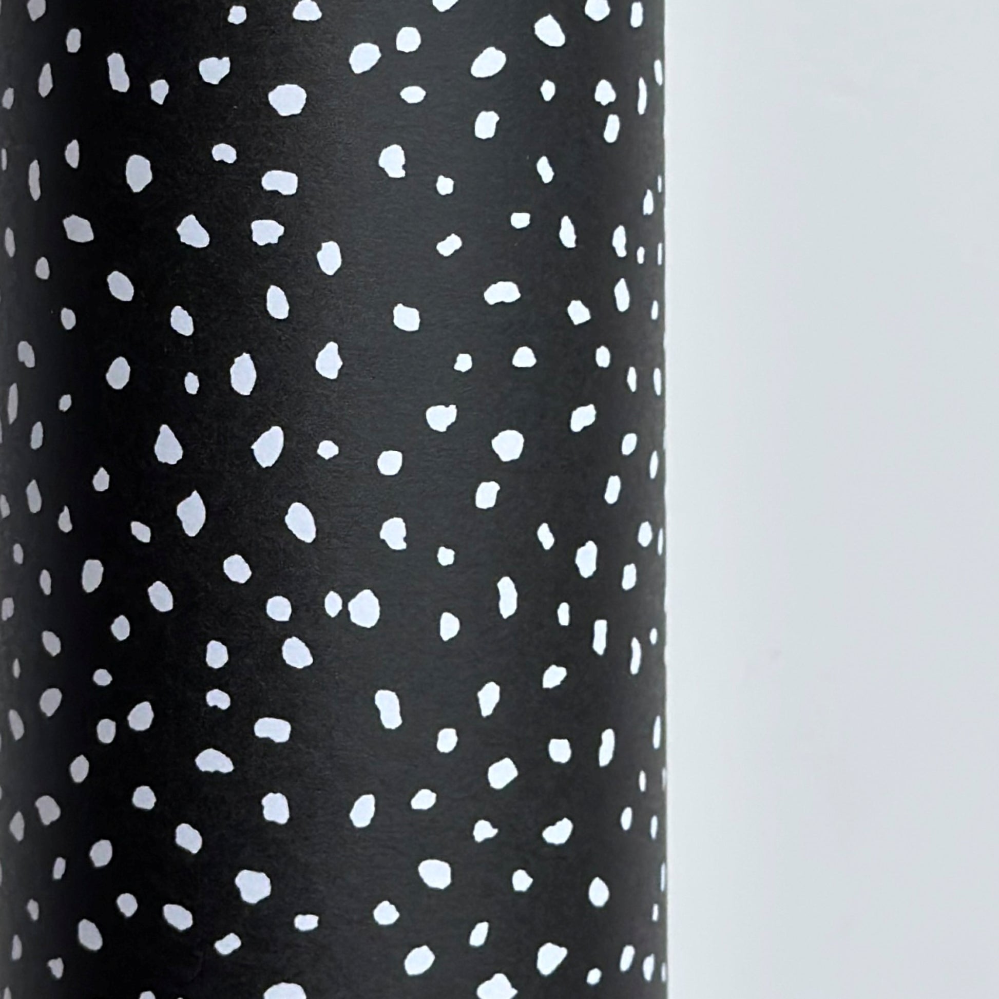 a sheet of black wrapping paper with a white speckle pattern