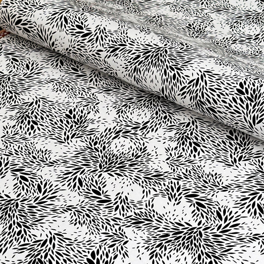 a sheet of wrapping paper with a black floral design on white