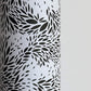 a sheet of wrapping paper with a black floral design on white