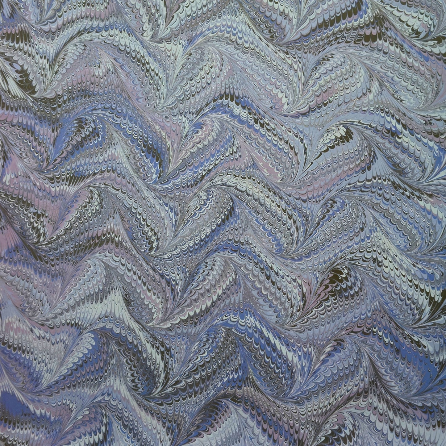 printed marbled wrapping paper by Jemma Lewis with a marbled pattern in blue and purple
