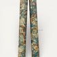 printed marbled wrapping paper by Jemma Lewis with a marbled pattern in blue, yellow, brown and cream. Rolled