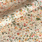 Printed marbled wrapping paper by Jemma Lewis Marbling. Marbled paper in bright yellow, pink and green on white backdrop.