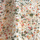 Printed marbled wrapping paper by Jemma Lewis Marbling. Marbled paper in bright yellow, pink and green on white backdrop.