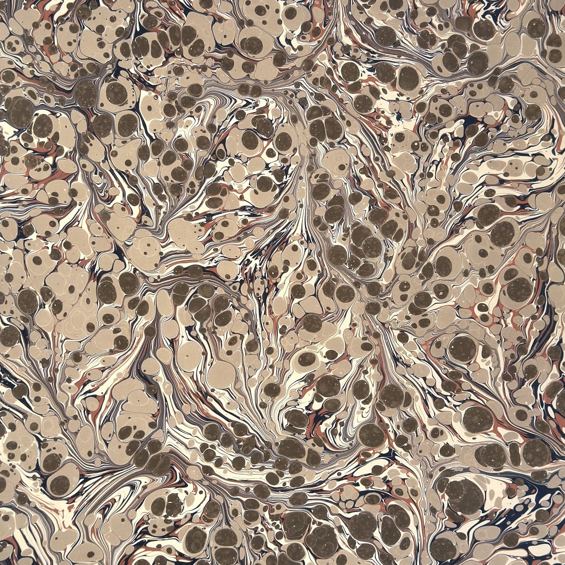 sheet of printed marbled wrapping paper by Jemma Lewis, stone effect in taupe, blush pink and beige