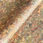 printed marbled wrapping paper by Jemma Lewis with a marbled pattern in brown, green and yellow autumnal tones