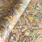 printed marbled wrapping paper by Jemma Lewis with a marbled pattern in blush pink, mustard, pale blue, brown and raspberry.