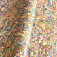 printed marbled wrapping paper by Jemma Lewis with a marbled pattern in blush pink, mustard, pale blue, brown and raspberry.