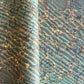 sheet of printed marbled wrapping paper by Jemma Lewis, ripple effect in teal green, ochre and pink